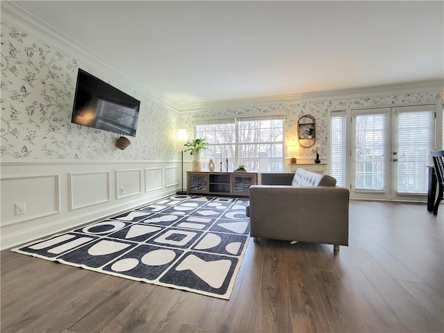 living room with wood-type flooring, french doors, and crown molding