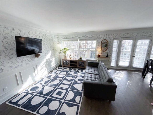 living room featuring french doors, dark hardwood / wood-style floors, and crown molding