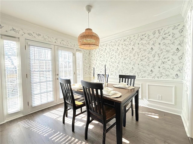 dining space with dark hardwood / wood-style floors and french doors