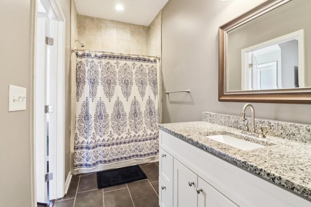 bathroom with tile patterned flooring and vanity