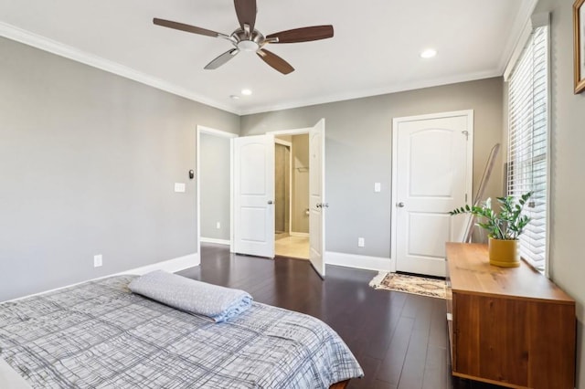 bedroom featuring ornamental molding, dark wood-type flooring, and ceiling fan