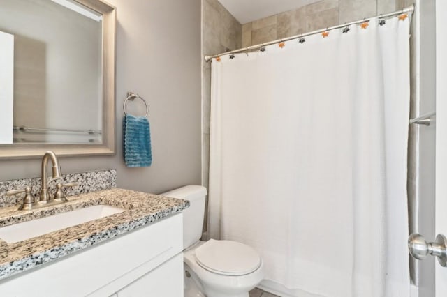 bathroom with vanity, toilet, and a shower with shower curtain