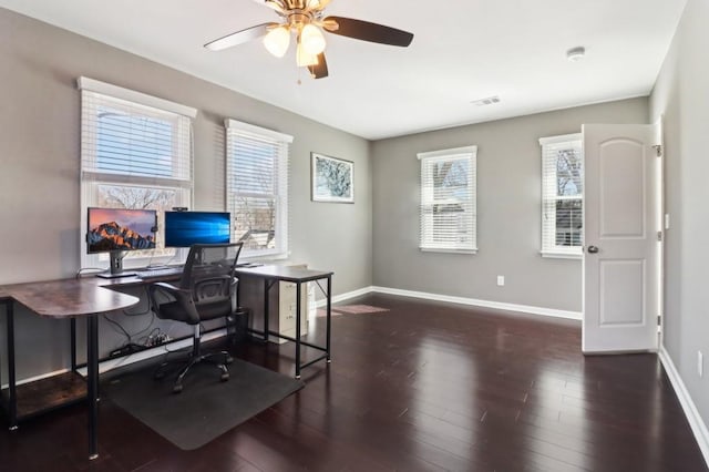 home office featuring dark wood-type flooring and ceiling fan