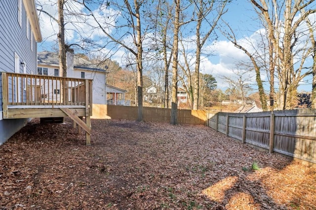 view of yard featuring a wooden deck