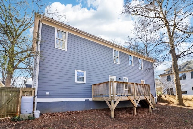 rear view of house featuring a deck