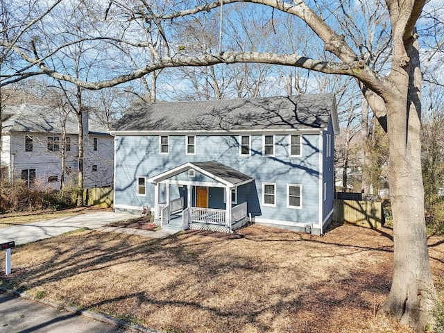 colonial-style house featuring a porch