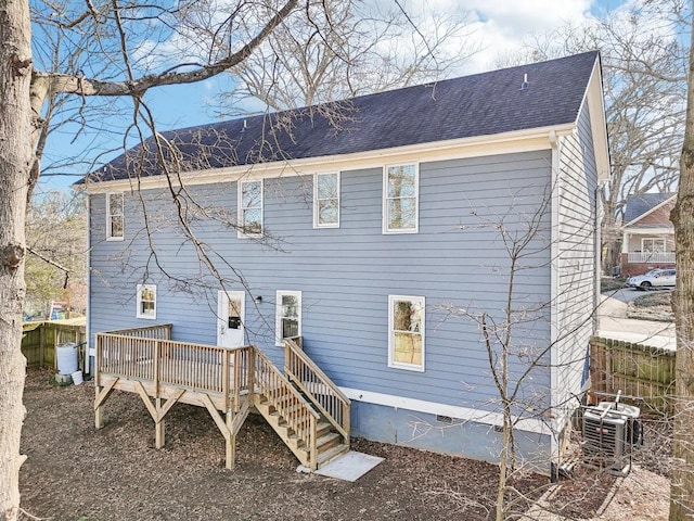 rear view of property with a deck and central air condition unit