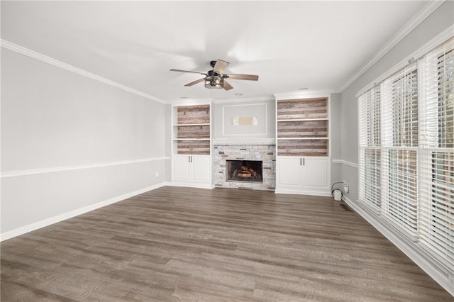 unfurnished living room featuring a fireplace, built in features, ceiling fan, and dark hardwood / wood-style flooring