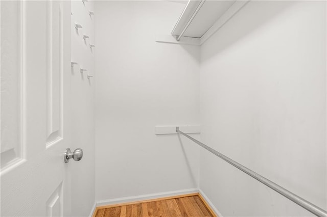 spacious closet featuring hardwood / wood-style floors