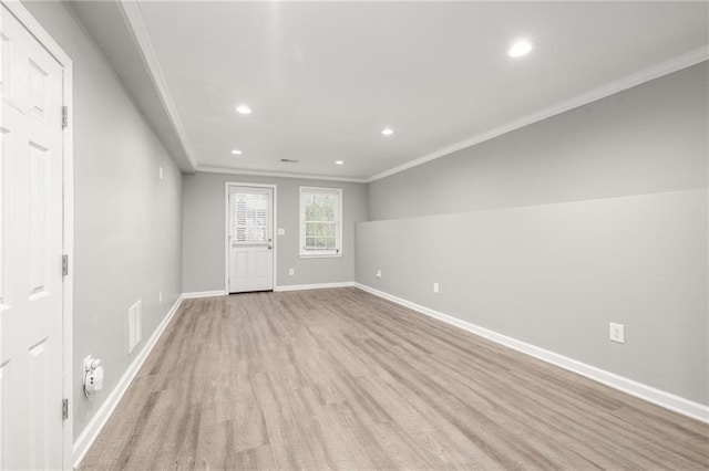 entrance foyer featuring light hardwood / wood-style floors and crown molding