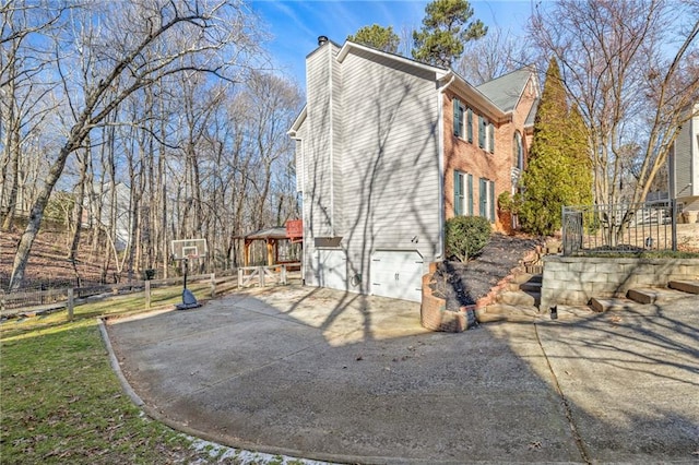 view of property exterior featuring a garage