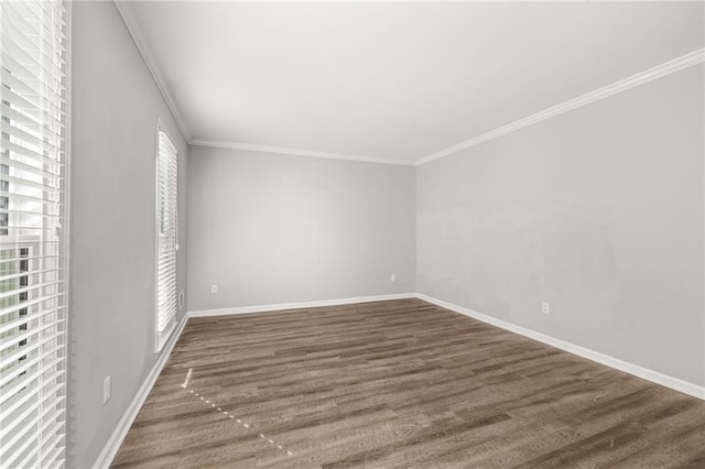 unfurnished room featuring ornamental molding and dark hardwood / wood-style flooring