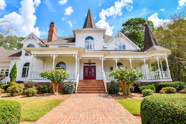 victorian house featuring covered porch