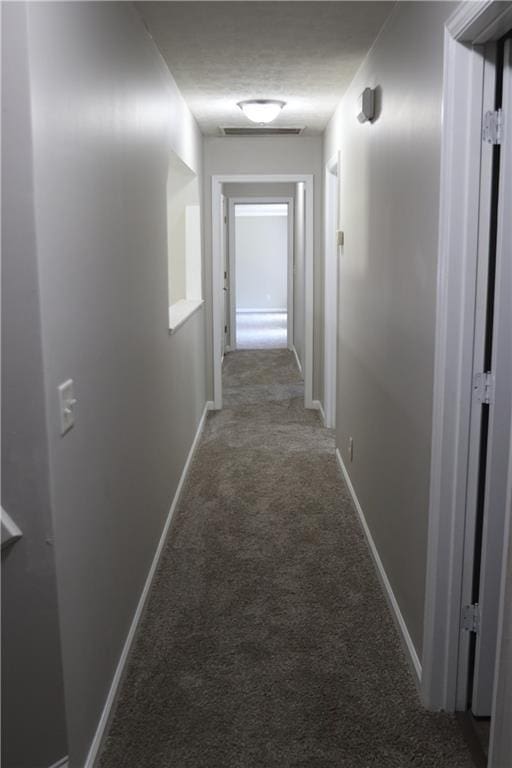 corridor with light colored carpet