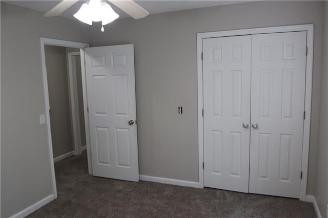 unfurnished bedroom with a closet, dark carpet, and ceiling fan