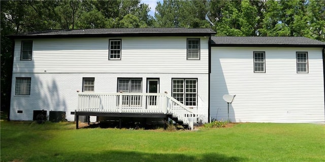 back of house featuring a yard