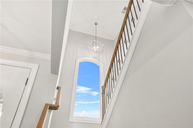 detailed view of ornamental molding and a chandelier