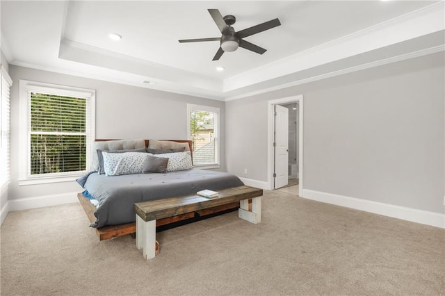 bedroom featuring a raised ceiling, light colored carpet, baseboards, crown molding, and recessed lighting