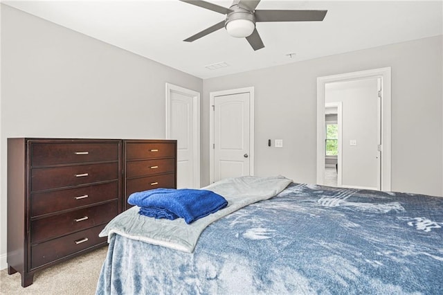 bedroom with light carpet and ceiling fan
