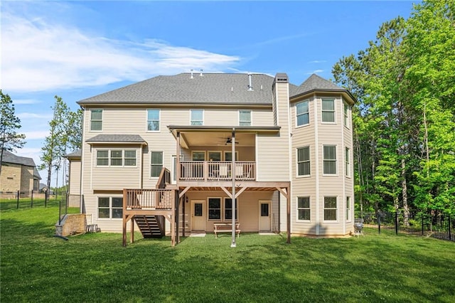 back of property featuring stairway, a wooden deck, a ceiling fan, and a chimney