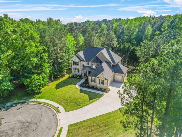 view of subject property featuring a heavily wooded area