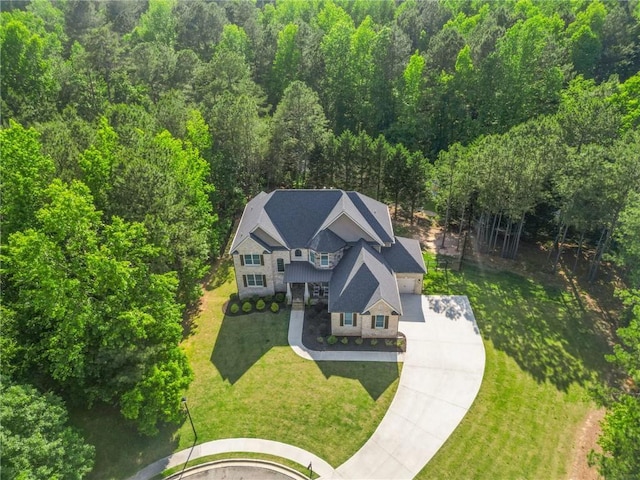 view of subject property featuring a forest