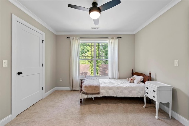 bedroom with ceiling fan, light carpet, and ornamental molding