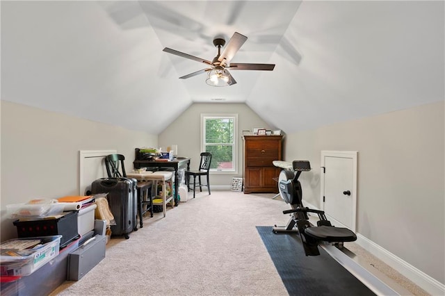 workout room featuring lofted ceiling, ceiling fan, and carpet floors