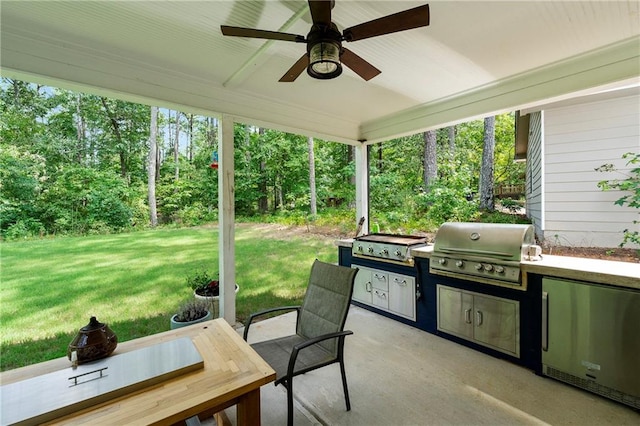 view of patio with grilling area, area for grilling, and ceiling fan