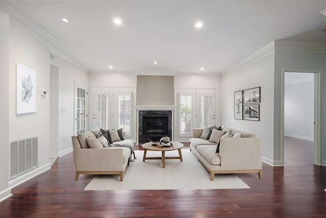 175 15th St NE Unit 410, Atlanta, GA 30309 - living room with wood finished floors, crown molding, baseboards, recessed lighting, and a premium fireplace