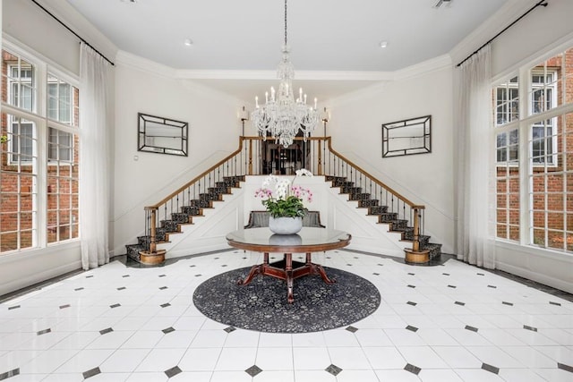 175 15th St NE Unit 410, Atlanta, GA 30309 - entryway with stairway, plenty of natural light, a chandelier, crown molding, and recessed lighting