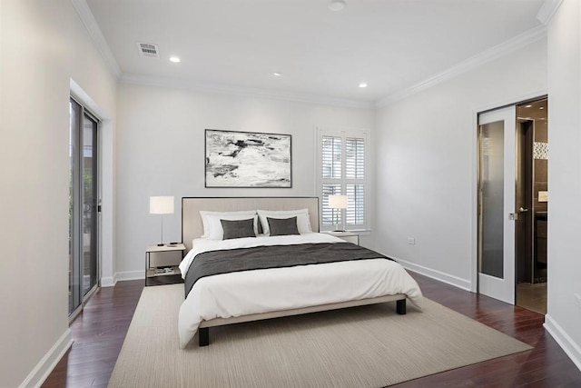 175 15th St NE Unit 410, Atlanta, GA 30309 - bedroom with crown molding, dark wood-style flooring, baseboards, and recessed lighting