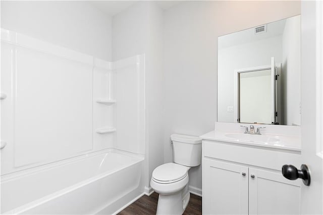 full bath featuring visible vents, baseboards, toilet, wood finished floors, and vanity