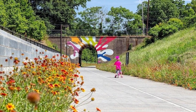 view of community featuring fence