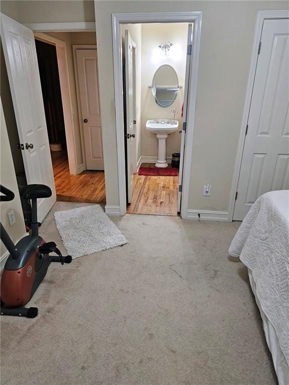 carpeted bedroom with ensuite bath