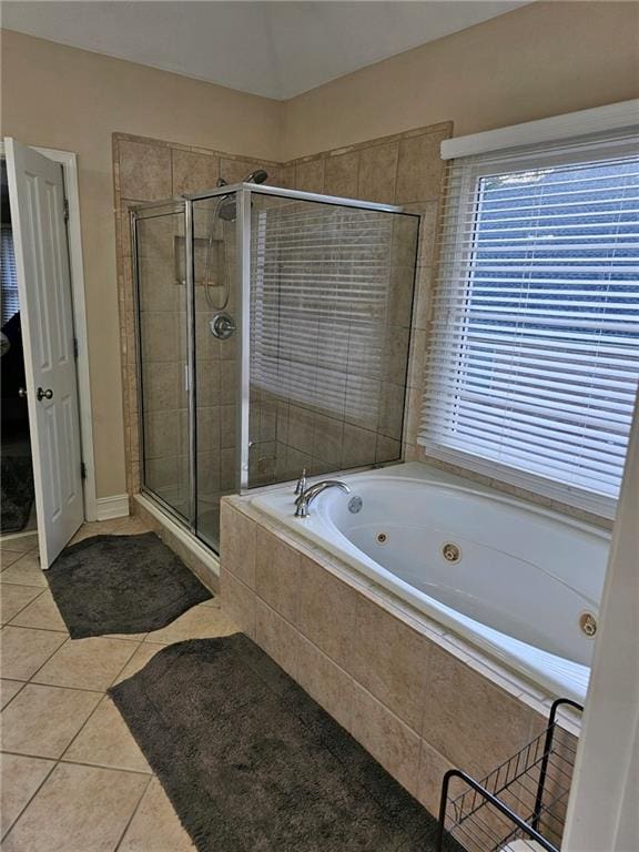 bathroom featuring separate shower and tub and tile patterned flooring