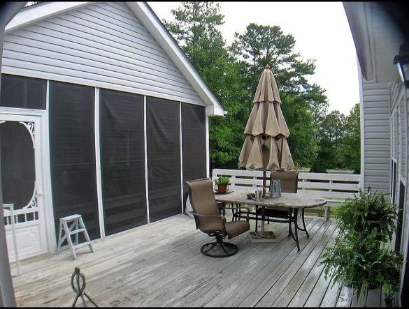 wooden terrace with a sunroom