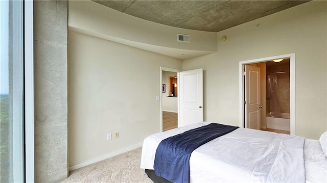 3300 Windy Ridge Parkway SE Unit 1121, Atlanta, GA 30339 - bedroom with carpet, ensuite bath, and baseboards