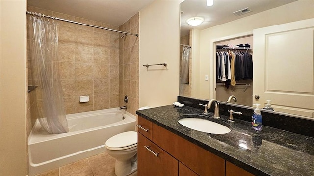 3300 Windy Ridge Parkway SE Unit 1121, Atlanta, GA 30339 - full bath featuring shower / bath combo, vanity, tile patterned flooring, and toilet