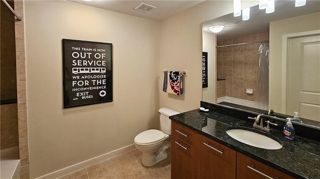 3300 Windy Ridge Parkway SE Unit 1121, Atlanta, GA 30339 - bathroom featuring toilet, tiled shower, vanity, tile patterned flooring, and baseboards