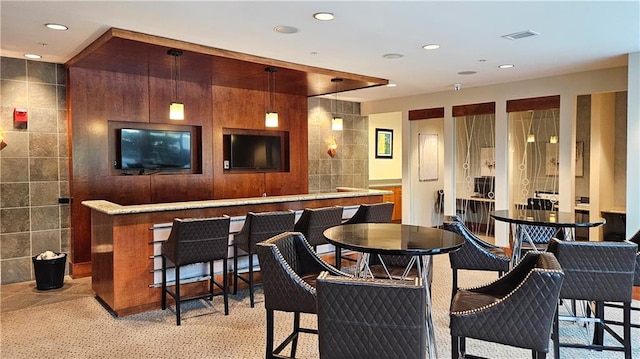 3300 Windy Ridge Parkway SE Unit 1121, Atlanta, GA 30339 - bar featuring recessed lighting, light carpet, tile walls, and decorative light fixtures