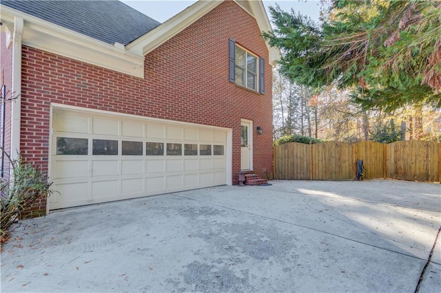 view of side of home with a garage