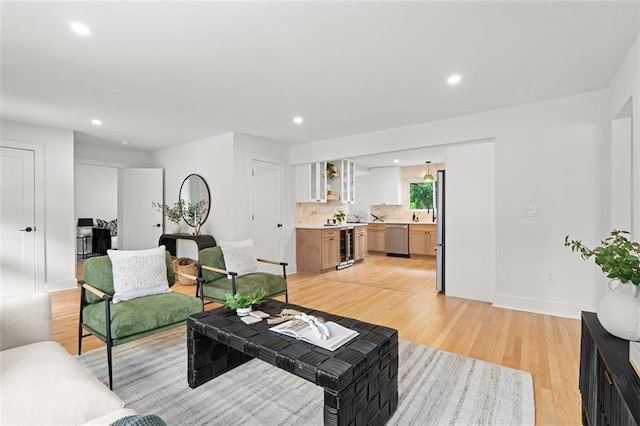 1494 May Ave SE, Atlanta, GA 30316 - living area featuring recessed lighting, light wood-style floors, baseboards, and beverage cooler