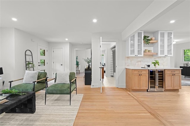 1494 May Ave SE, Atlanta, GA 30316 - living area with beverage cooler, light wood-style flooring, recessed lighting, and baseboards