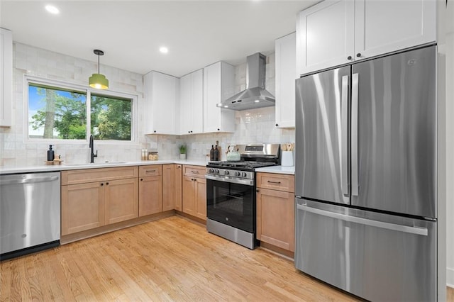 1494 May Ave SE, Atlanta, GA 30316 - kitchen featuring appliances with stainless steel finishes, wall chimney exhaust hood, a sink, decorative backsplash, and light countertops