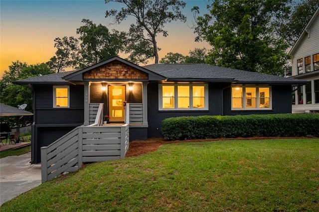 1494 May Ave SE, Atlanta, GA 30316 - view of front of property with a front yard, brick siding, concrete driveway, and an attached garage