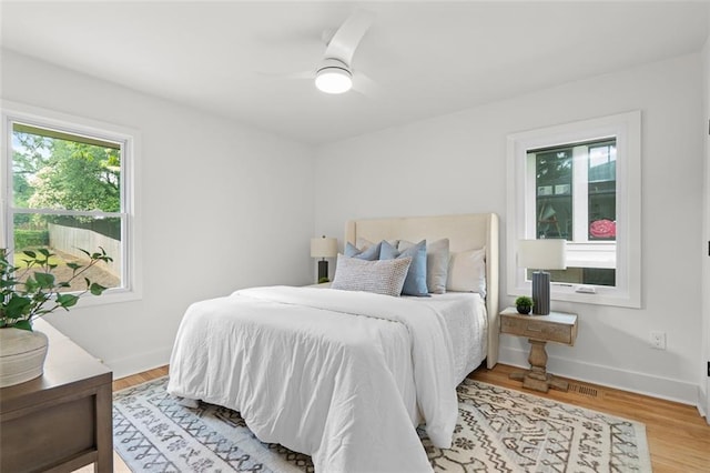 1494 May Ave SE, Atlanta, GA 30316 - bedroom featuring light wood-type flooring, baseboards, and a ceiling fan