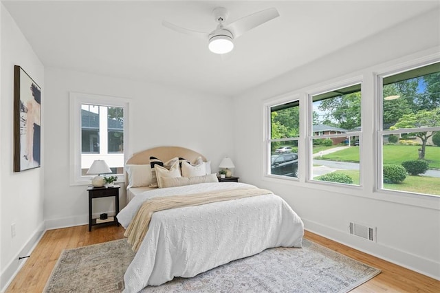 1494 May Ave SE, Atlanta, GA 30316 - bedroom featuring multiple windows, light wood-style flooring, and baseboards