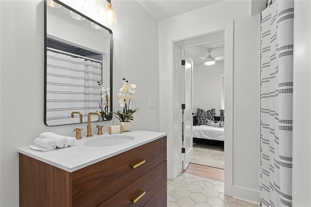 1494 May Ave SE, Atlanta, GA 30316 - ensuite bathroom with vanity, tile patterned floors, a ceiling fan, and a shower with shower curtain