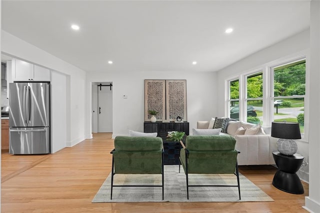 1494 May Ave SE, Atlanta, GA 30316 - living area featuring recessed lighting, light wood finished floors, baseboards, and a barn door